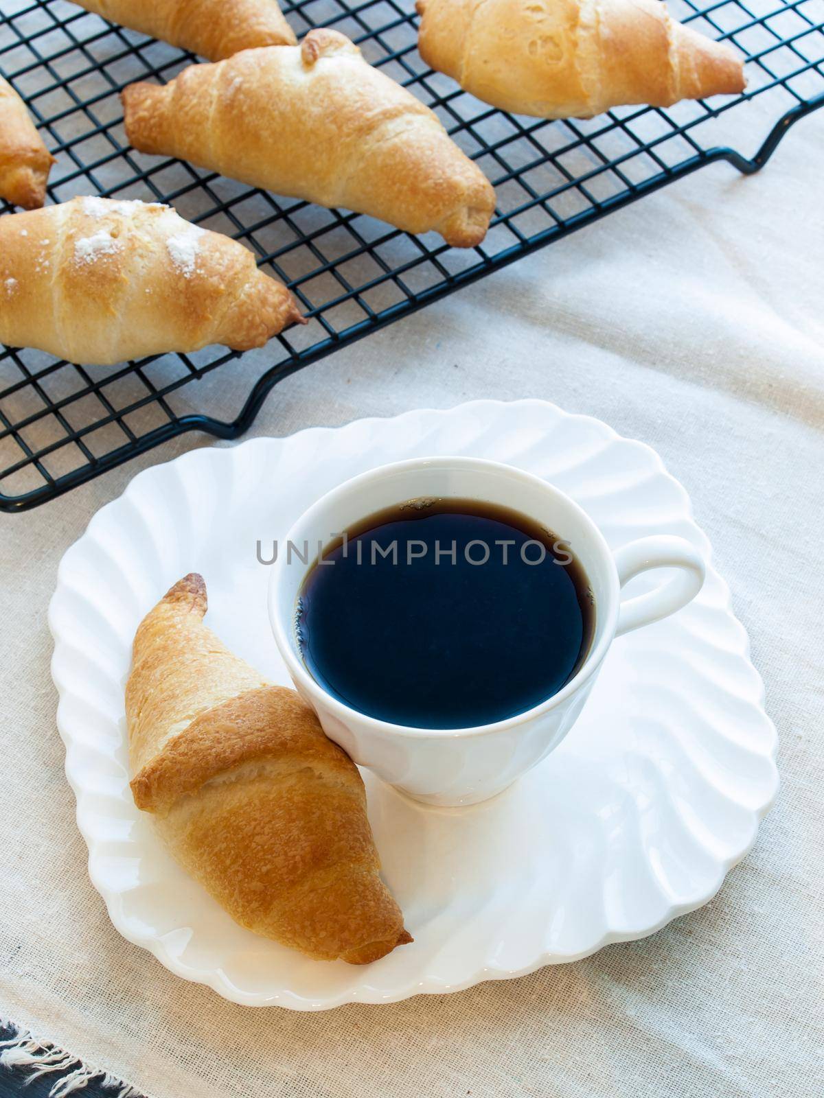 Eating small croissants for breakfast.