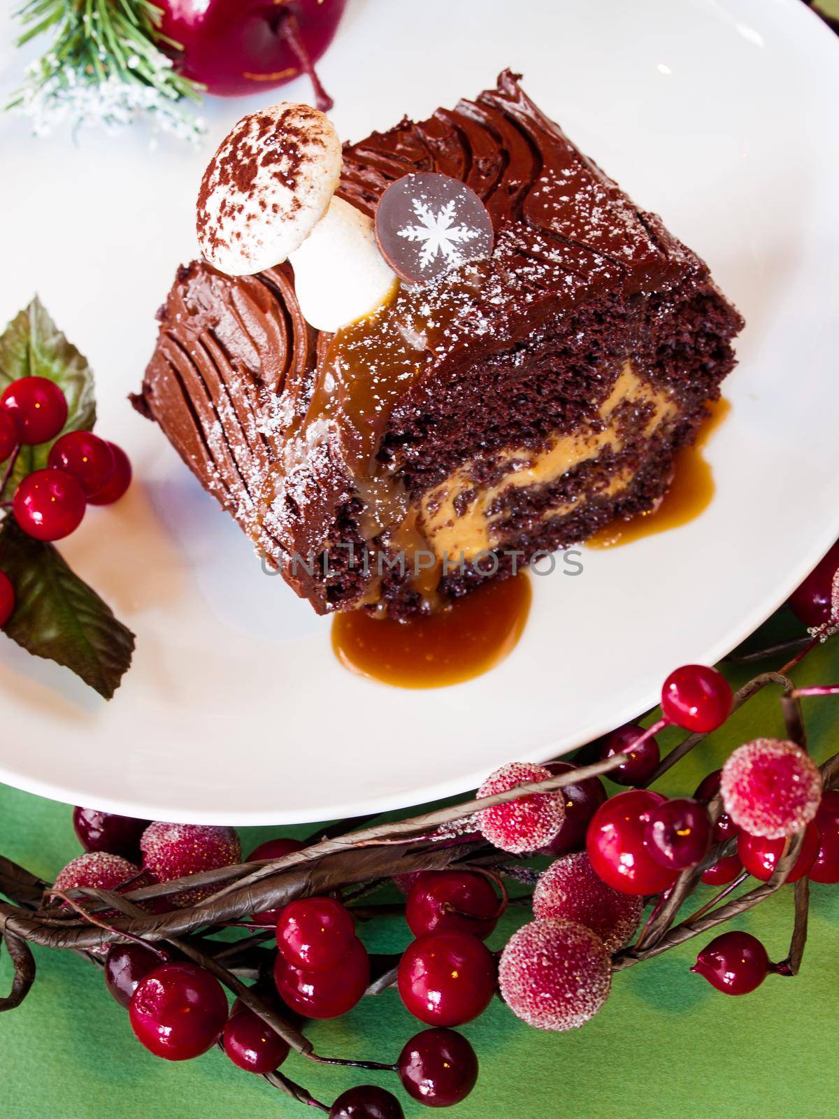 Traditional Christmas Yule Log cake decorated with marzipan mushrooms.
