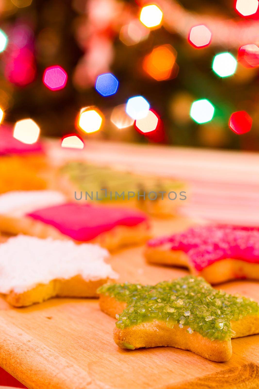 Colorful Christmas sugar cookies with hot chocolate.