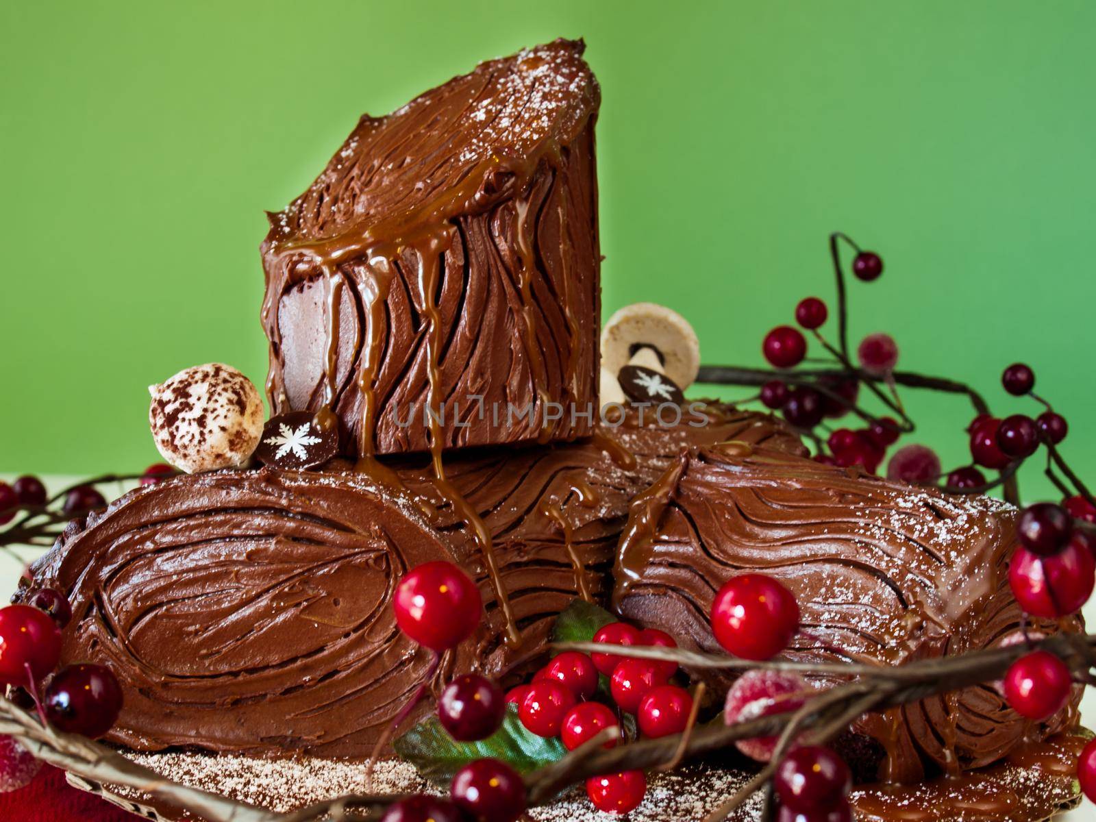 Traditional Christmas Yule Log cake decorated with marzipan mushrooms.