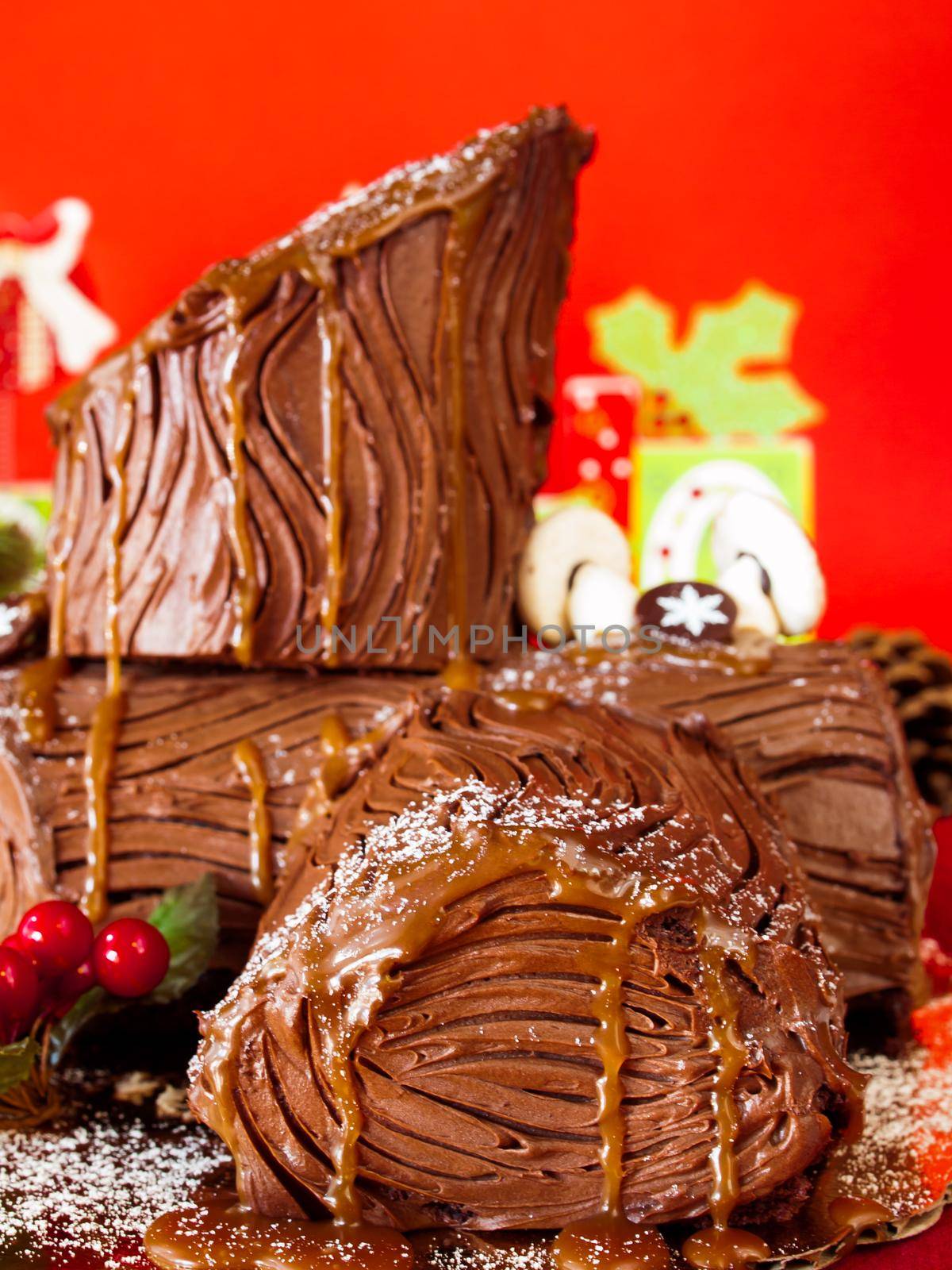 Traditional Christmas Yule Log cake decorated with marzipan mushrooms.