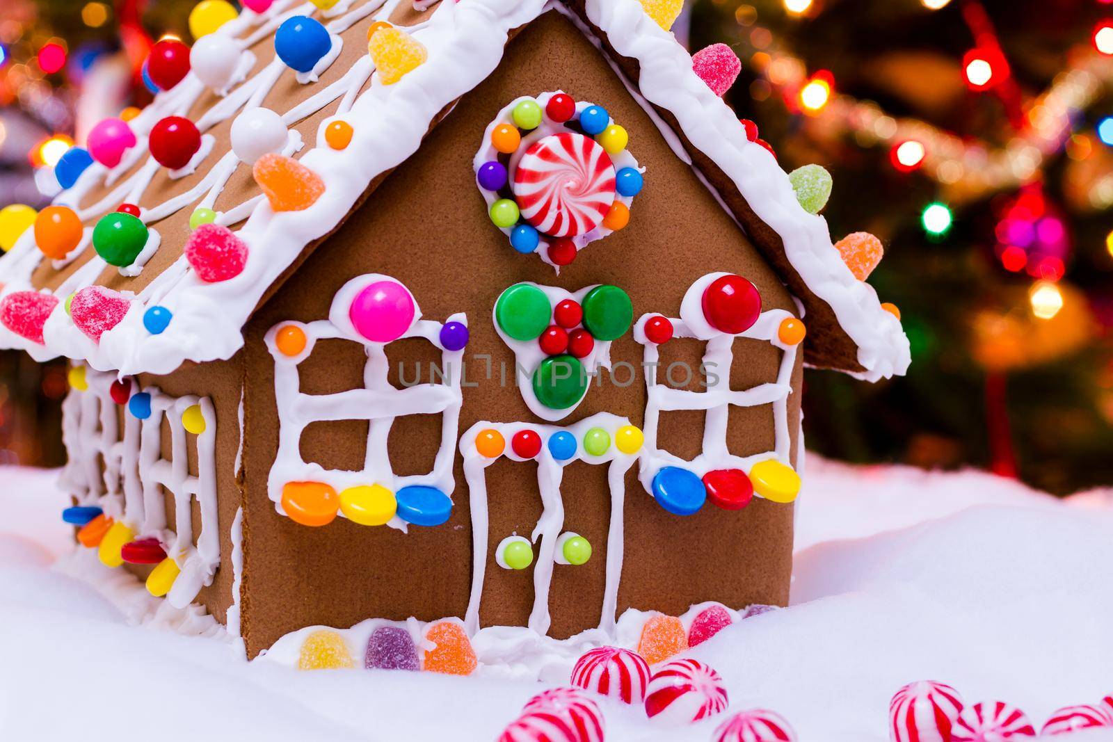 Gingerbread house with round peppermint candies.