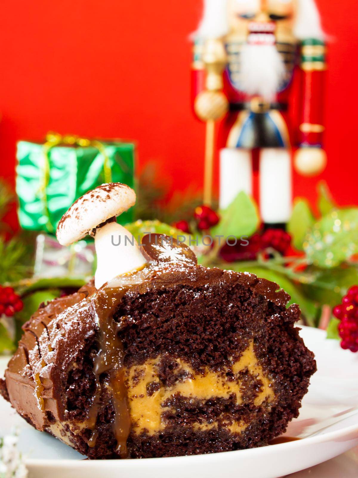 Traditional Christmas Yule Log cake decorated with marzipan mushrooms.