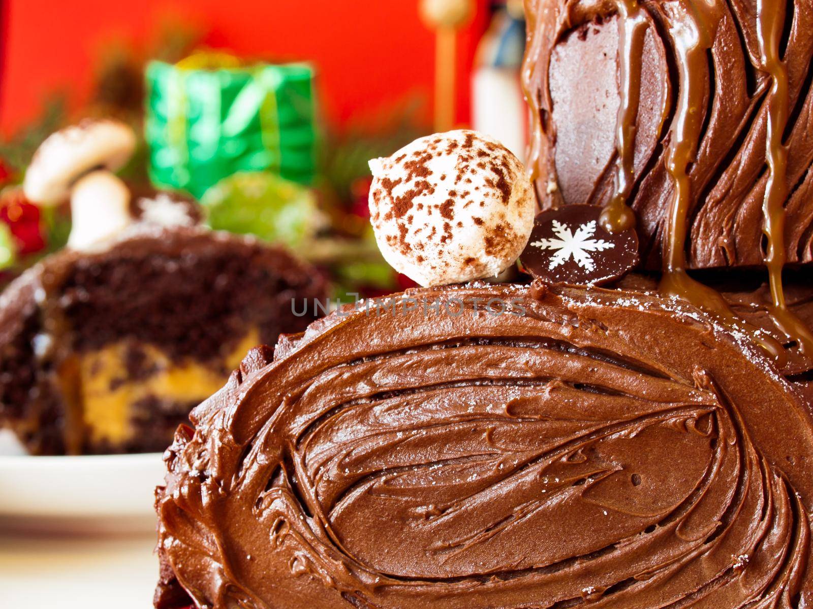 Traditional Christmas Yule Log cake decorated with marzipan mushrooms.