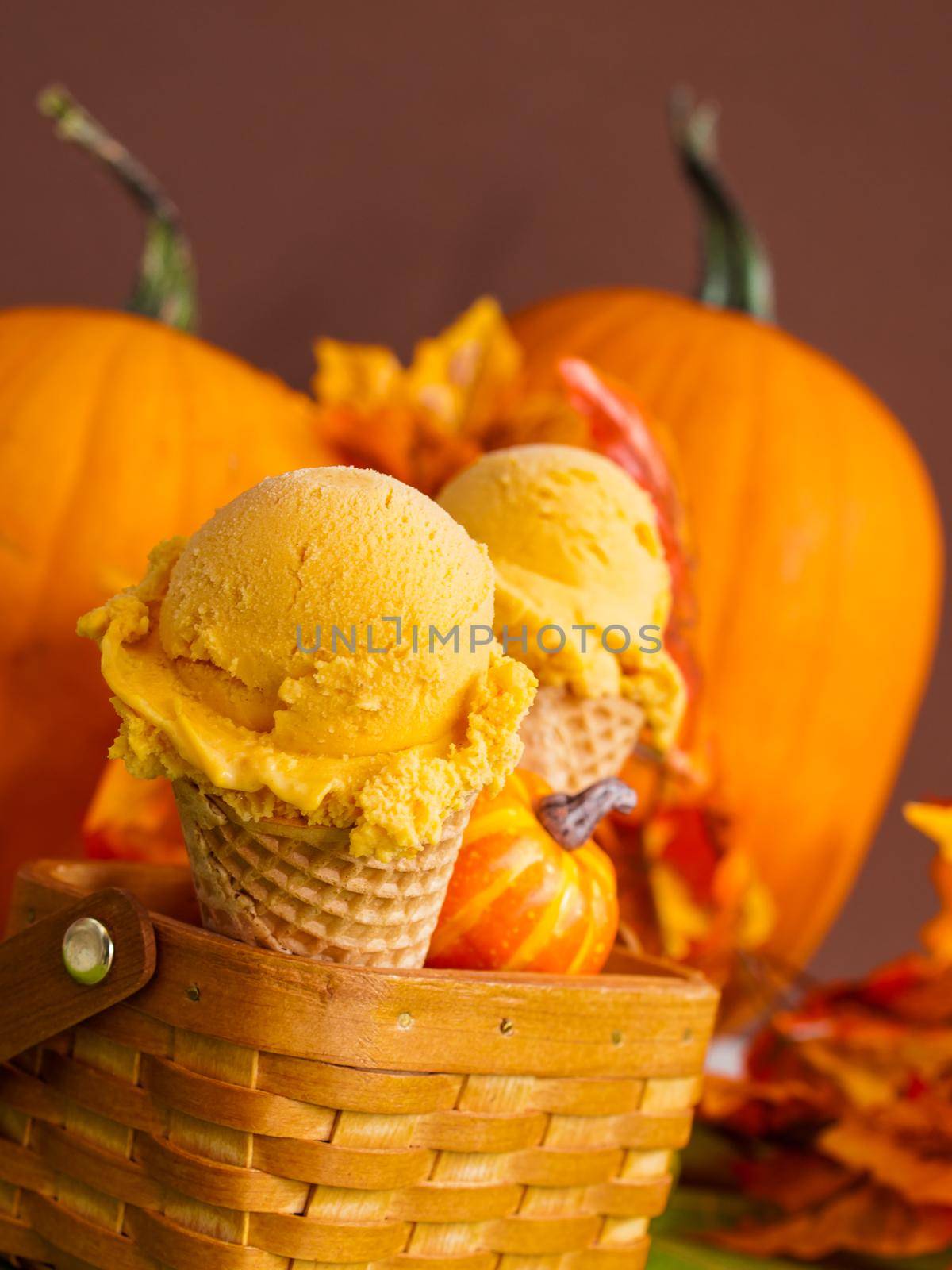 Scoop of gourmet pumpkin gelato in waffle cones.