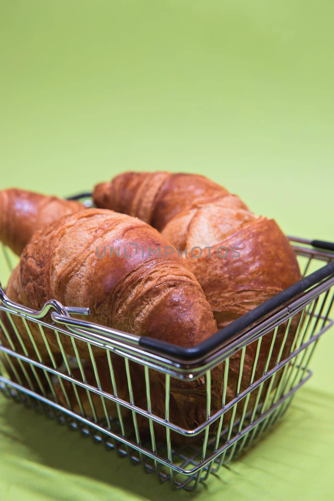 Macro shoot of croissants in shopping basket by anytka