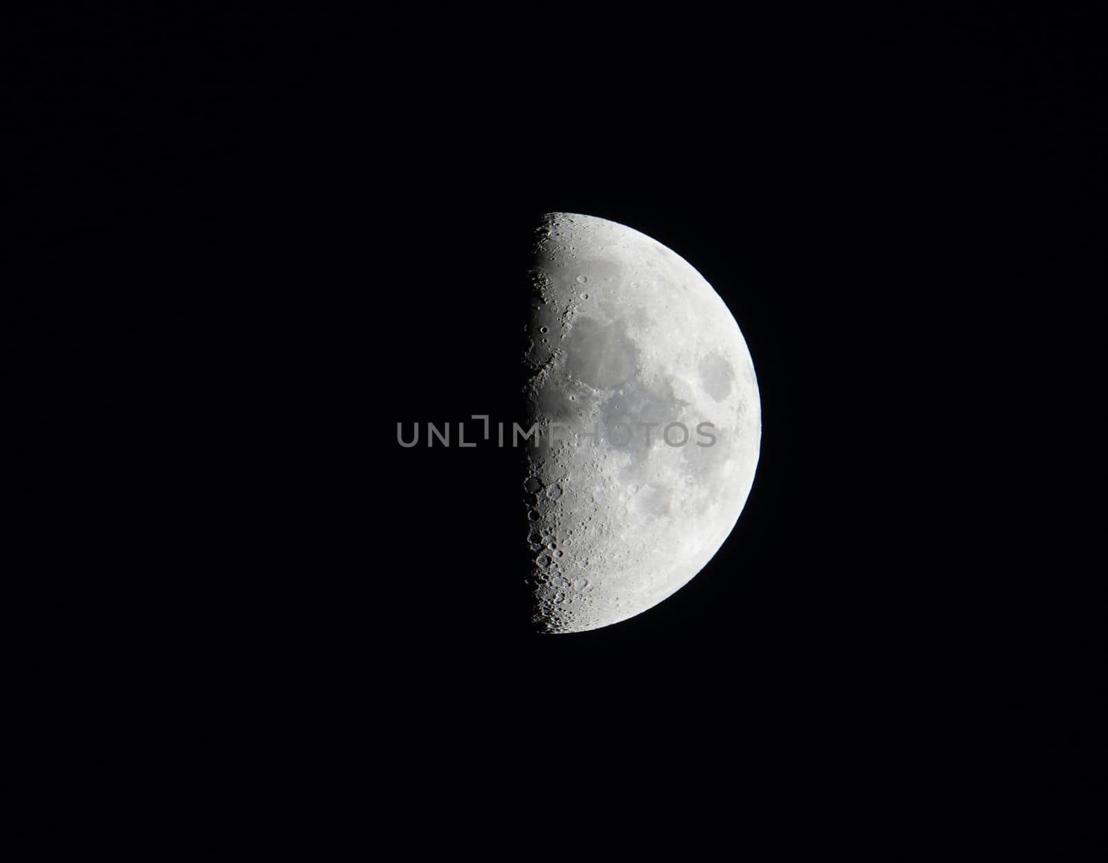 High quality photo of moon with craters on black night sky background. Astrophotography. High quality photo.