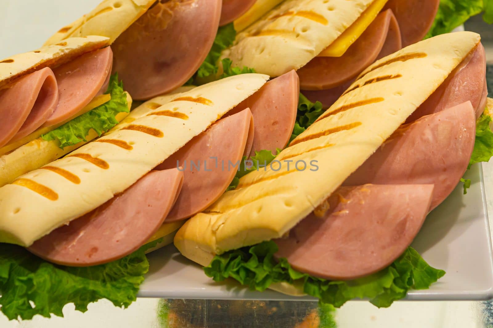 sausage sandwiches on the counter table close-up by roman112007