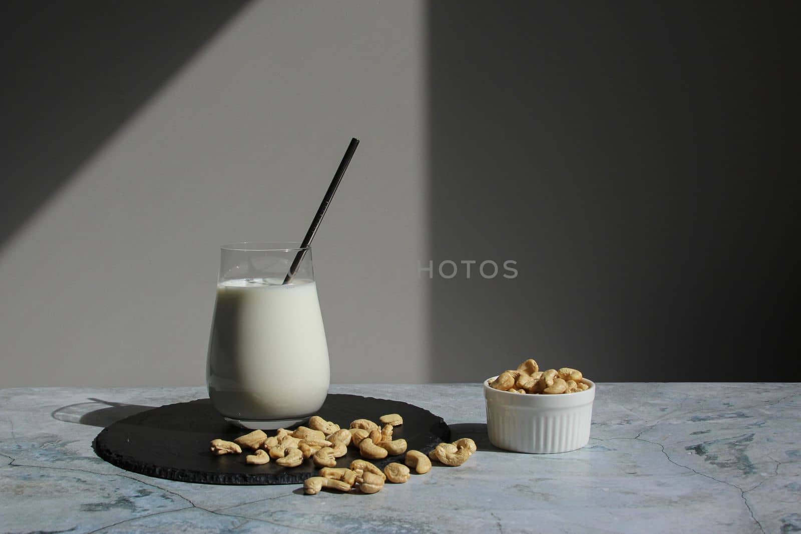 Vegan milk from nuts cashew on the cement table. Vegan or vegetables milk by IrinaKur