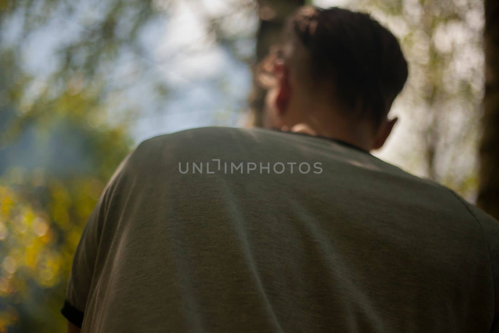 Back guy. Man in park. Close-up jacket. by OlegKopyov