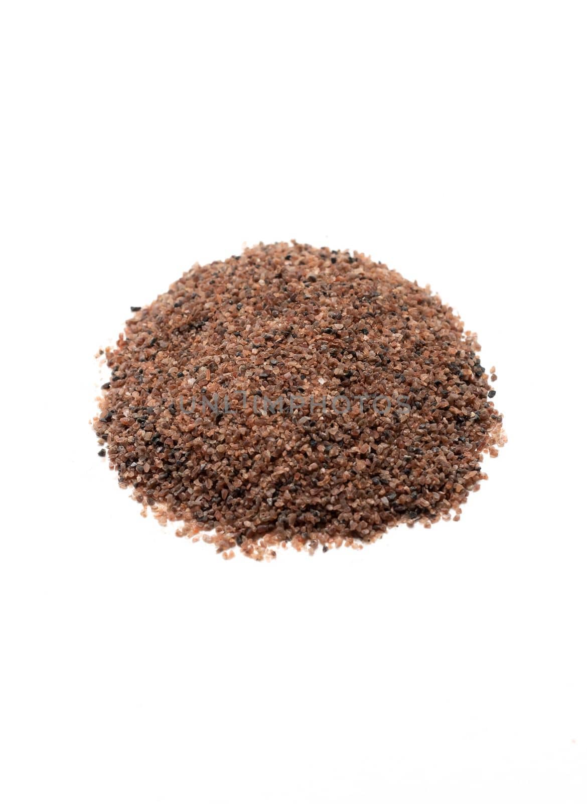 isolated Himalayan black salt, Kala Namak, cooling ayurvedic spice Indian Asian cuisine, healthy food. Kiln fired rock salt with a sulphurous, pungent smell. White background. Flatly, Vertical plane.