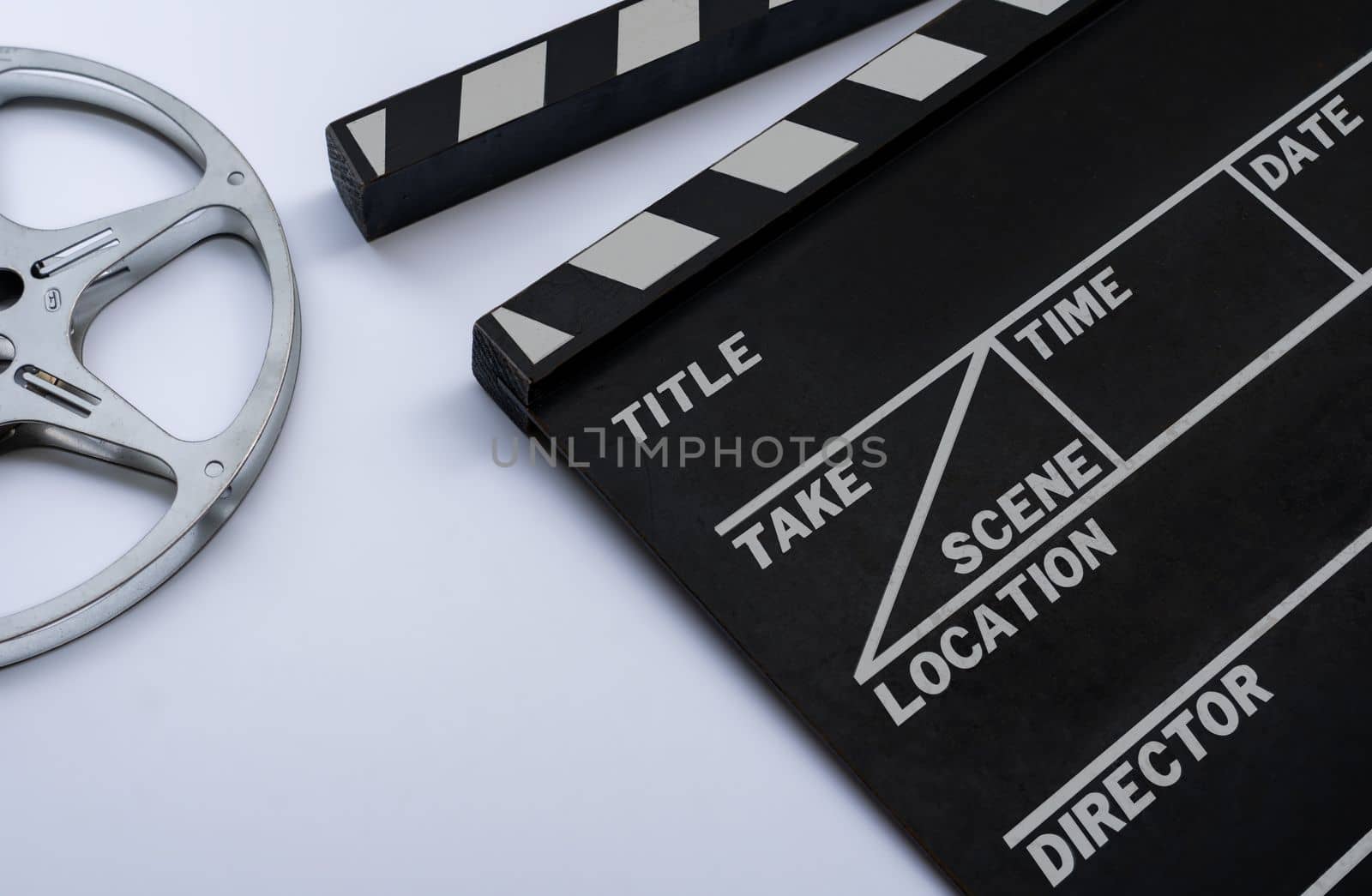 Close up of a vintage clapboard with filmstrip. by maramade