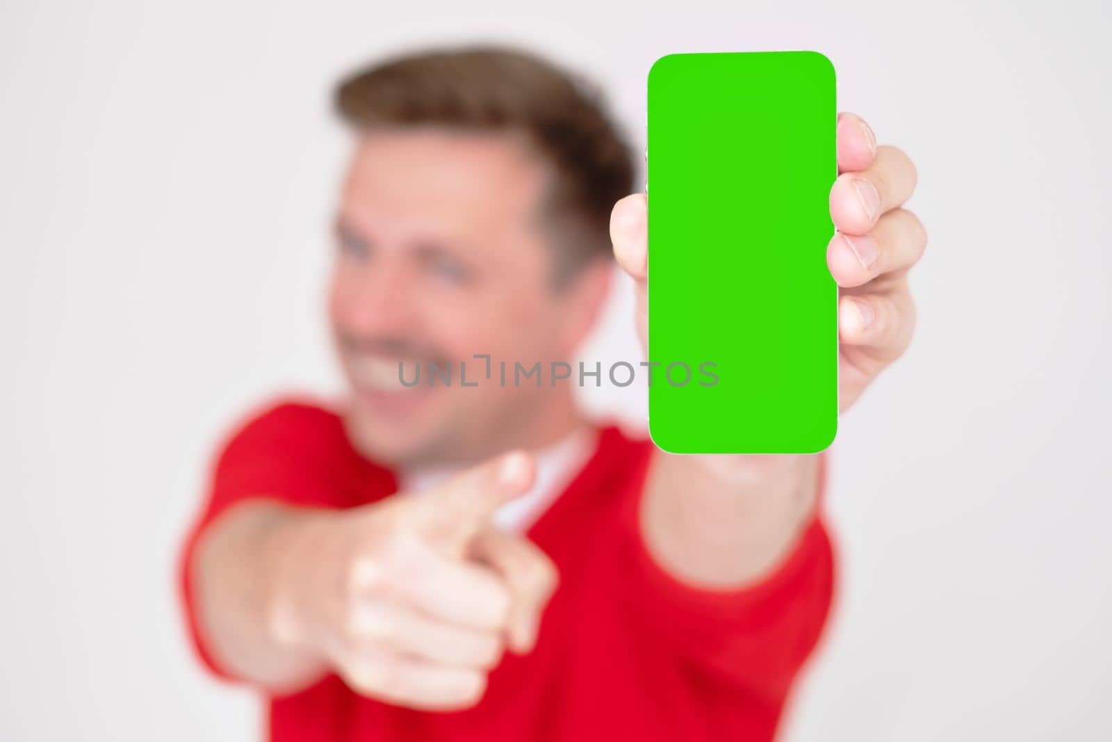 European guy show phone with empty screen. Gesture, big sale, new app, device, app and offer concept