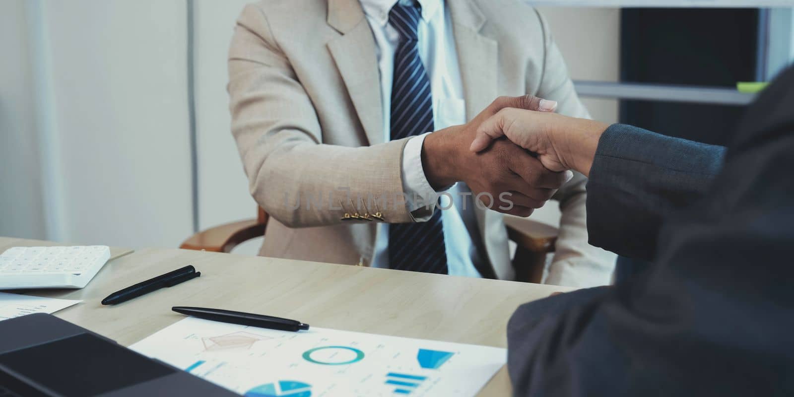 Business partnership handshake concept.Photo two coworkers handshaking process.Successful deal after great meeting.