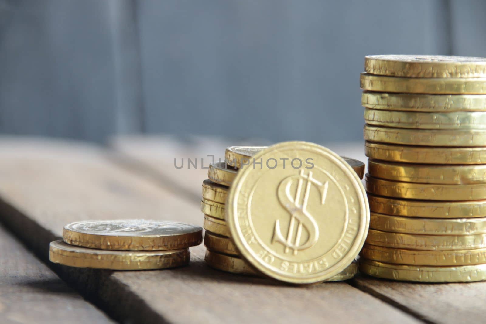 Business graph made of coins on a vintage background. by Markgraf