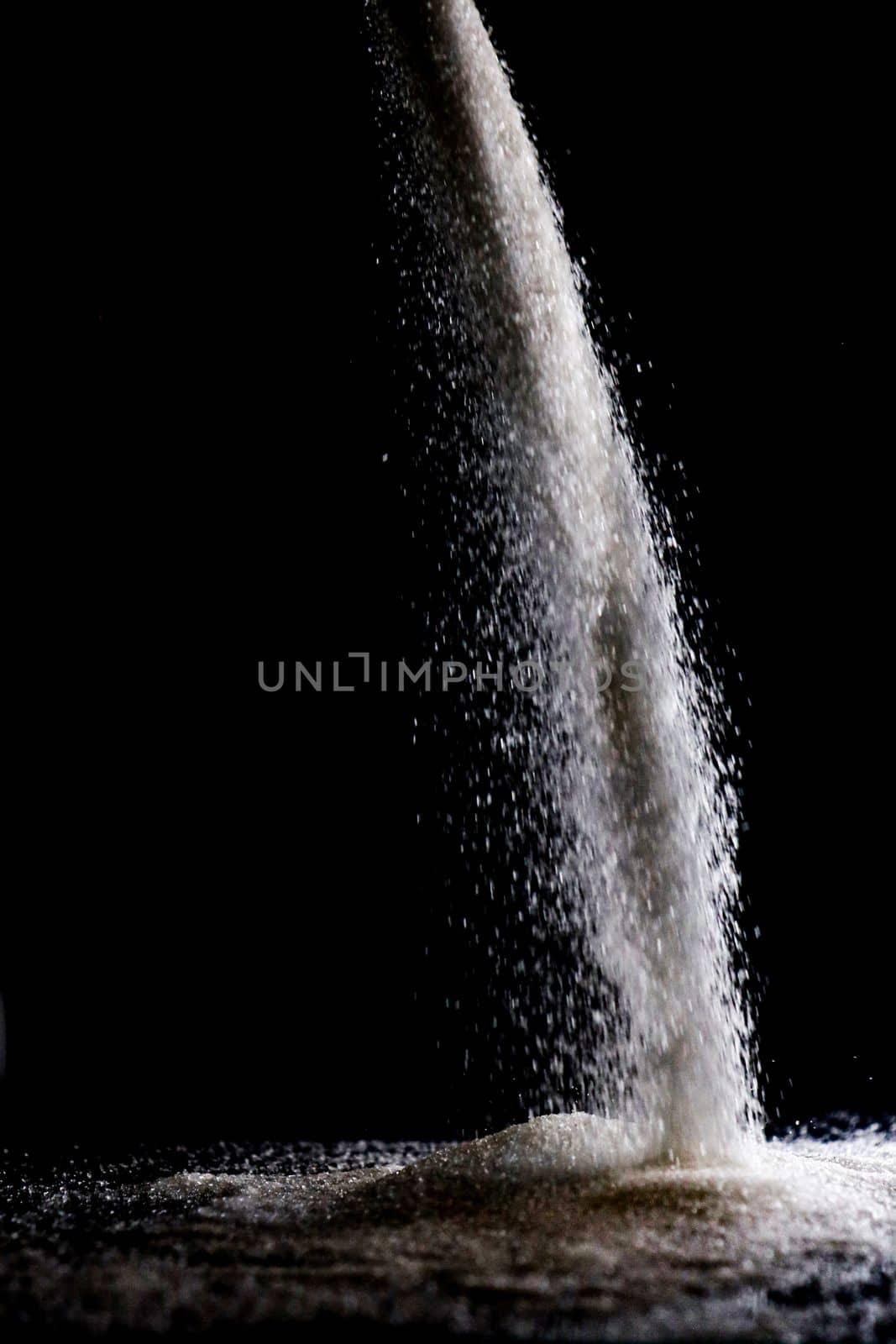 Sugar spill flow low light. High quality photo