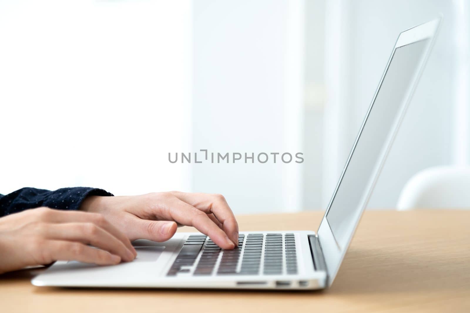 Close up of hands typing laptop. Selective focus on hands. Copy space. Office concept.