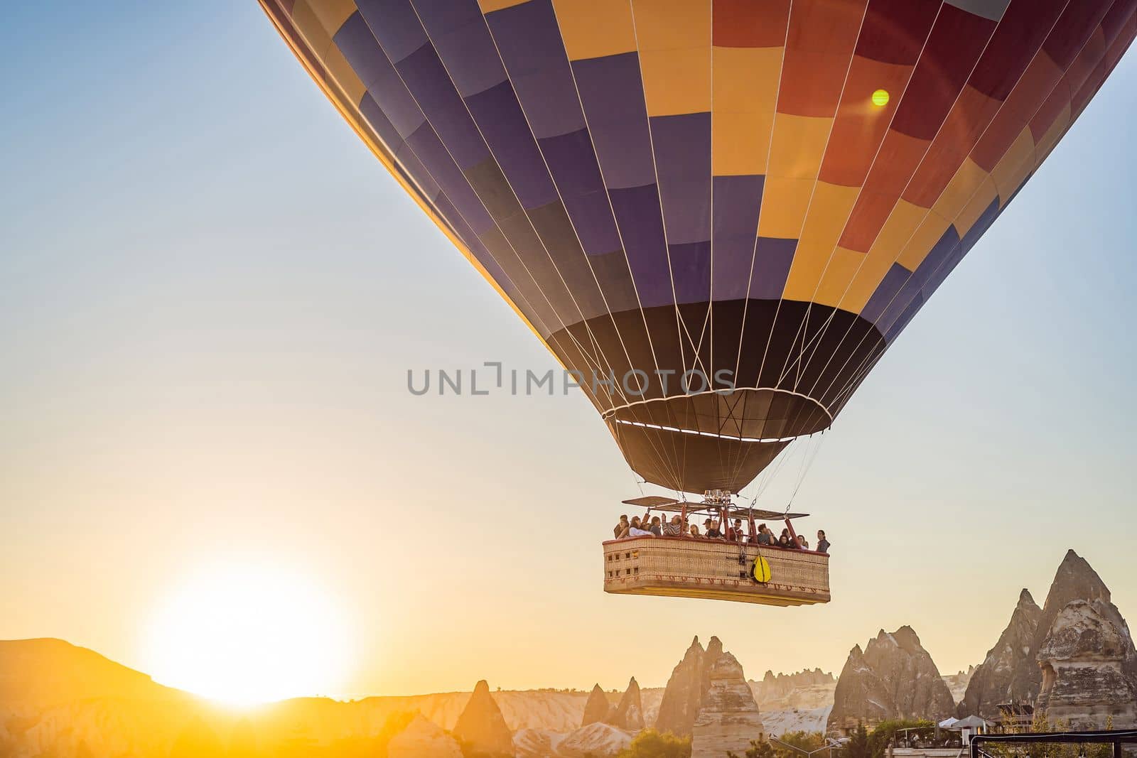 Colorful hot air balloon flying over Cappadocia, Turkey by galitskaya