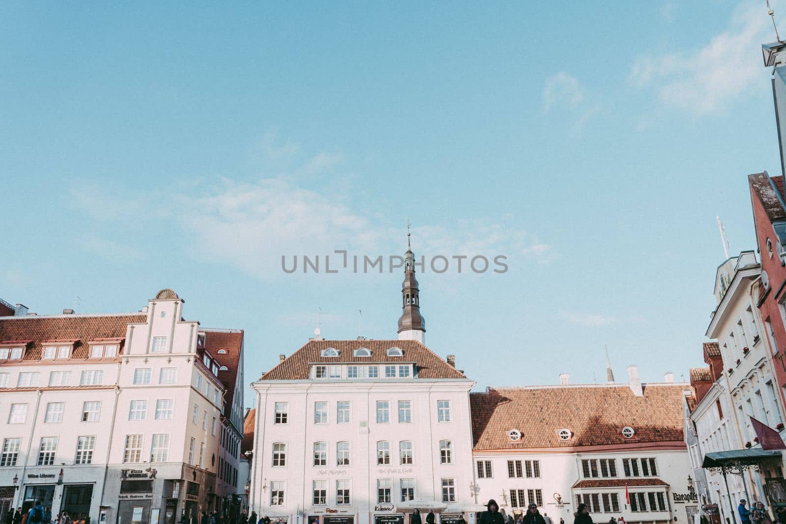 low angle view of a building in the old town of Tallinn with a blue sky at the background by Varaksina