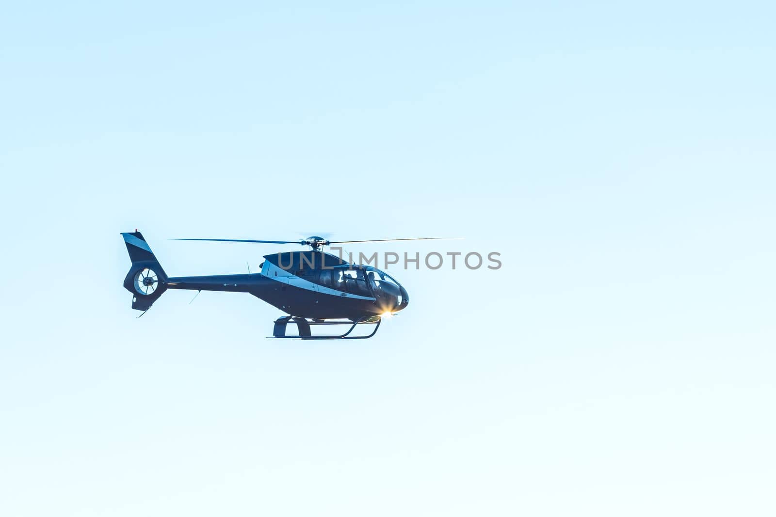 helicopter flying in the blue sky by Edophoto