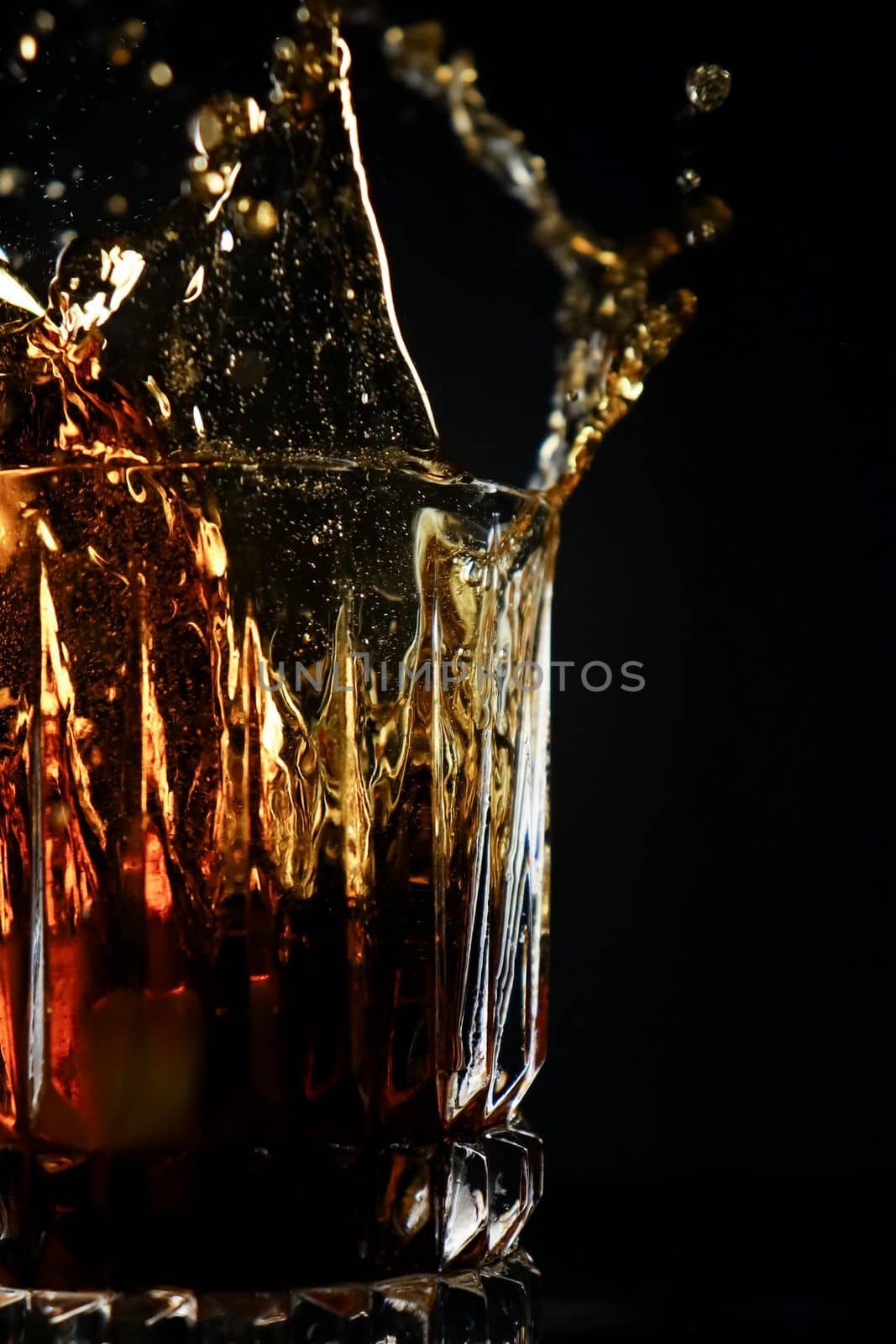 Drink Splashing in glass cup. High quality photo