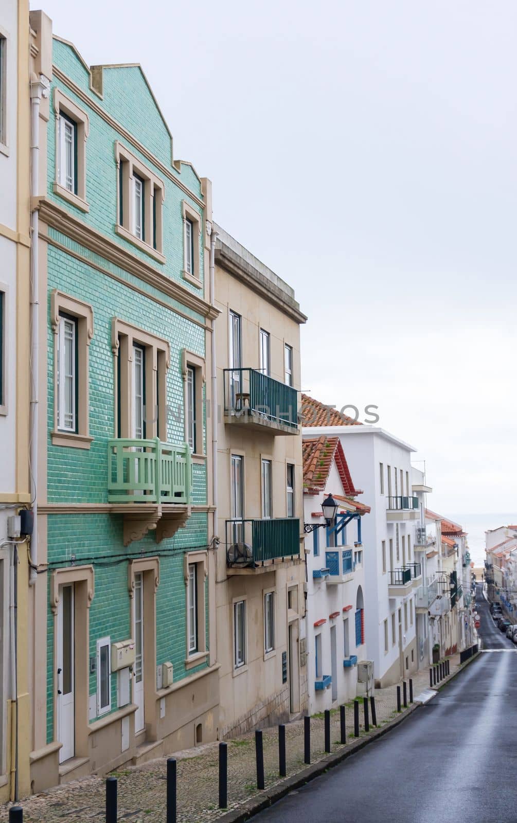 An empty old street leading to the ocean, in the historic center of the Portuguese city of Nazare