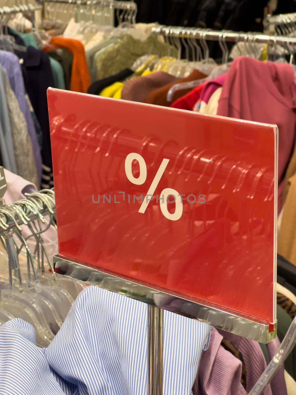 red and white percent sale sign in store mobile photo. High quality photo