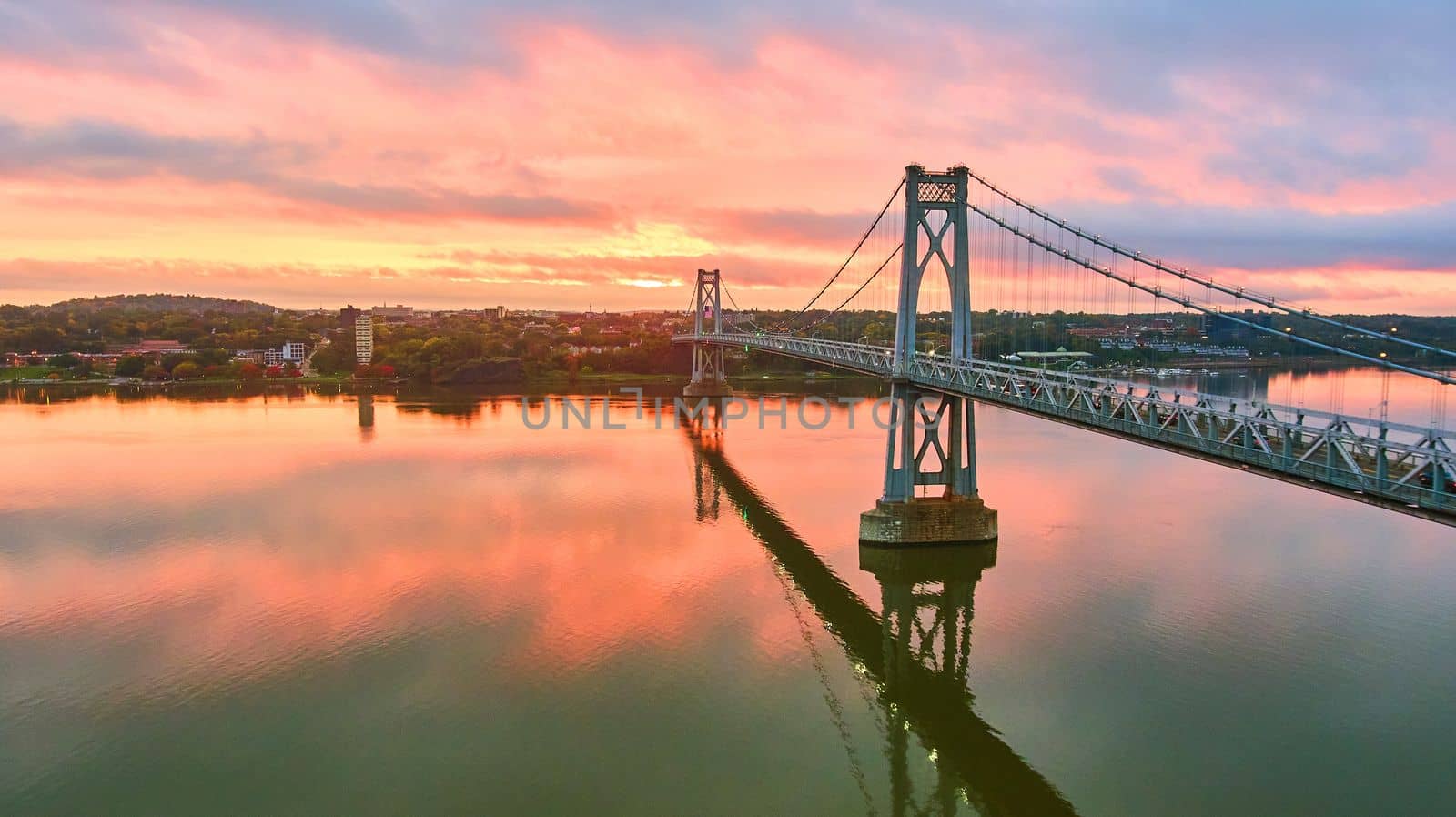 Aerial golden hour sunrise over stunning American New York bridge with pink light by njproductions