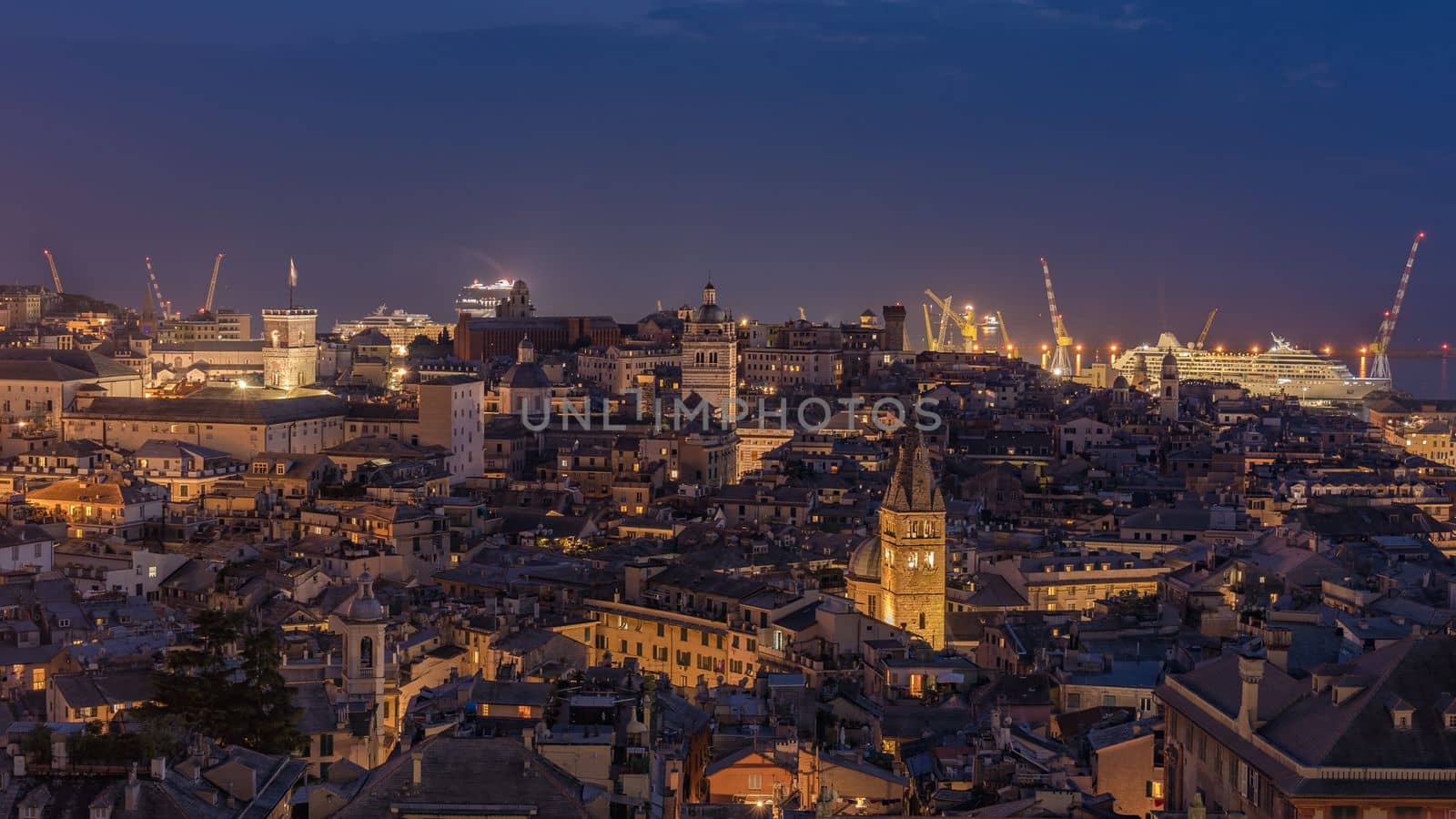 Genoa, Italy - 09 19 2020: Genoa harbor from Spianata Castelletto by night.