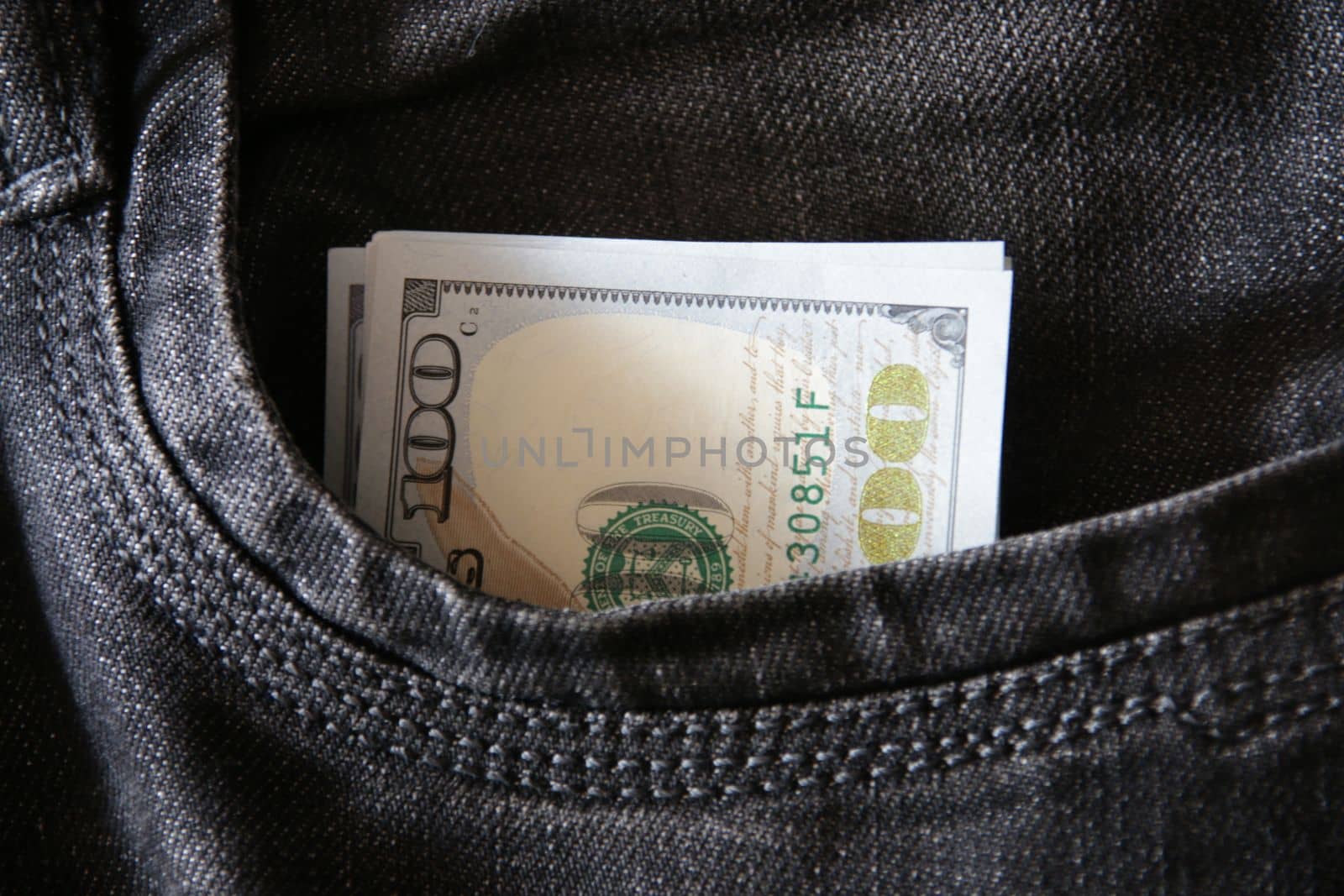 Money in jeans pocket. Profit concept. by Markgraf