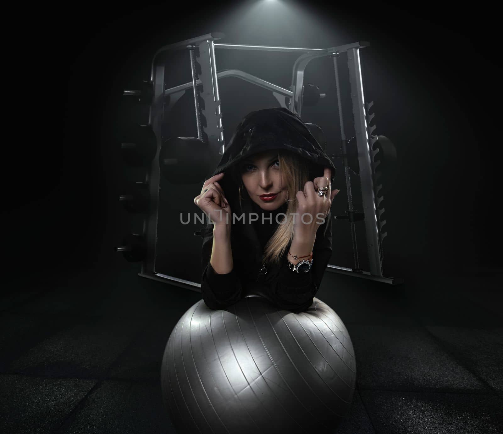 Strong woman doing weights.Sports lifestyle Beautiful fitness woman lifting dumbbells . Fitness sporty woman showing her well trained body. A beautiful girl's body with rippling muscles from strength training. High quality photo