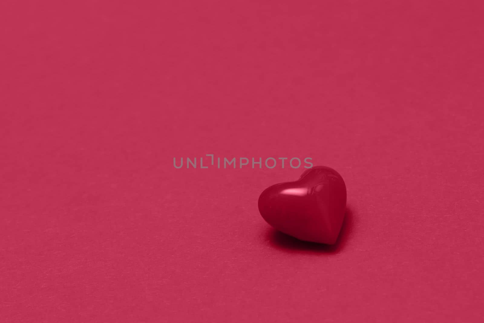 Valentines day viva magenta heart on same color background. Monochromatic vivid color. Valentine's day concept. Close up, copy space. by Ri6ka