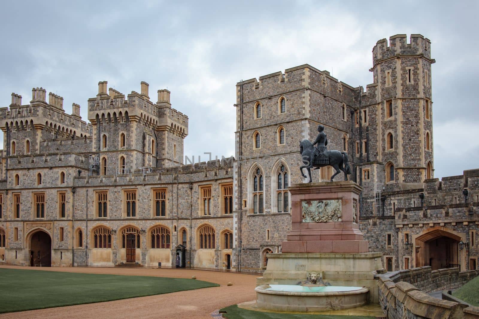 Windsor, UK, December 22nd 2022 - Windsor Castle from outside with statue by Suteren