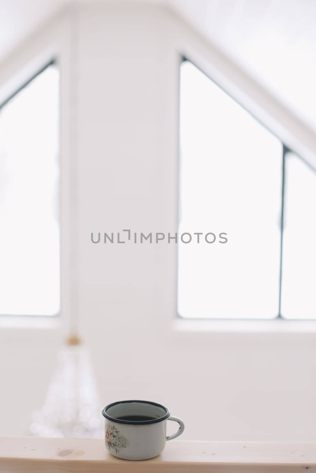 closeup of cup of coffee in luxury white interior.