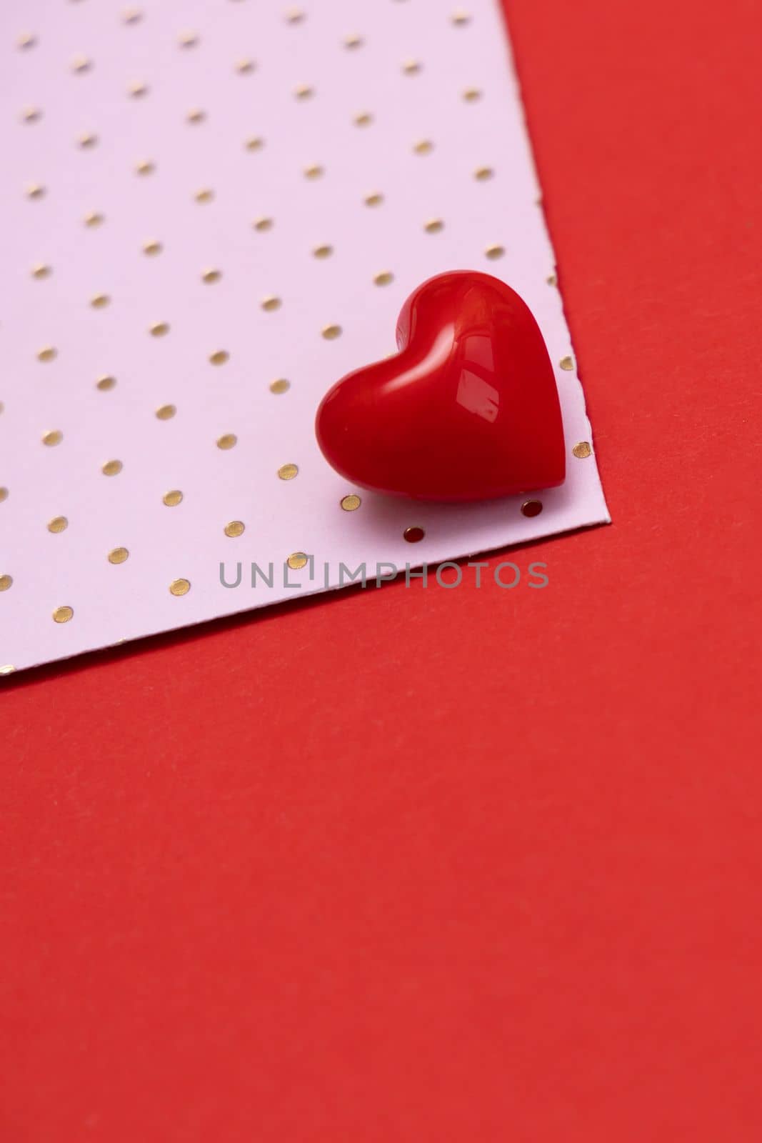 Valentines day red heart on same color background. Monochromatic vivid color. Valentine's day concept. Close up, copy space