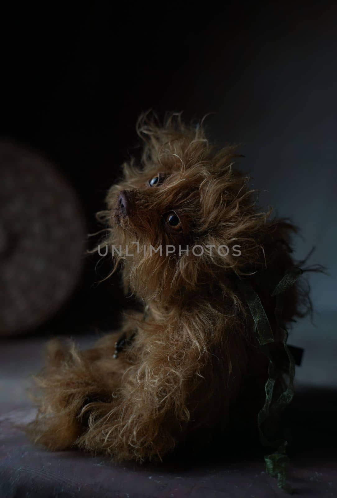 a photo of a handmade collectible teddy bear, suitable for printing in a calendar card or for inserting into a frame for delivering aesthetic pleasure in your free time. High quality photo
