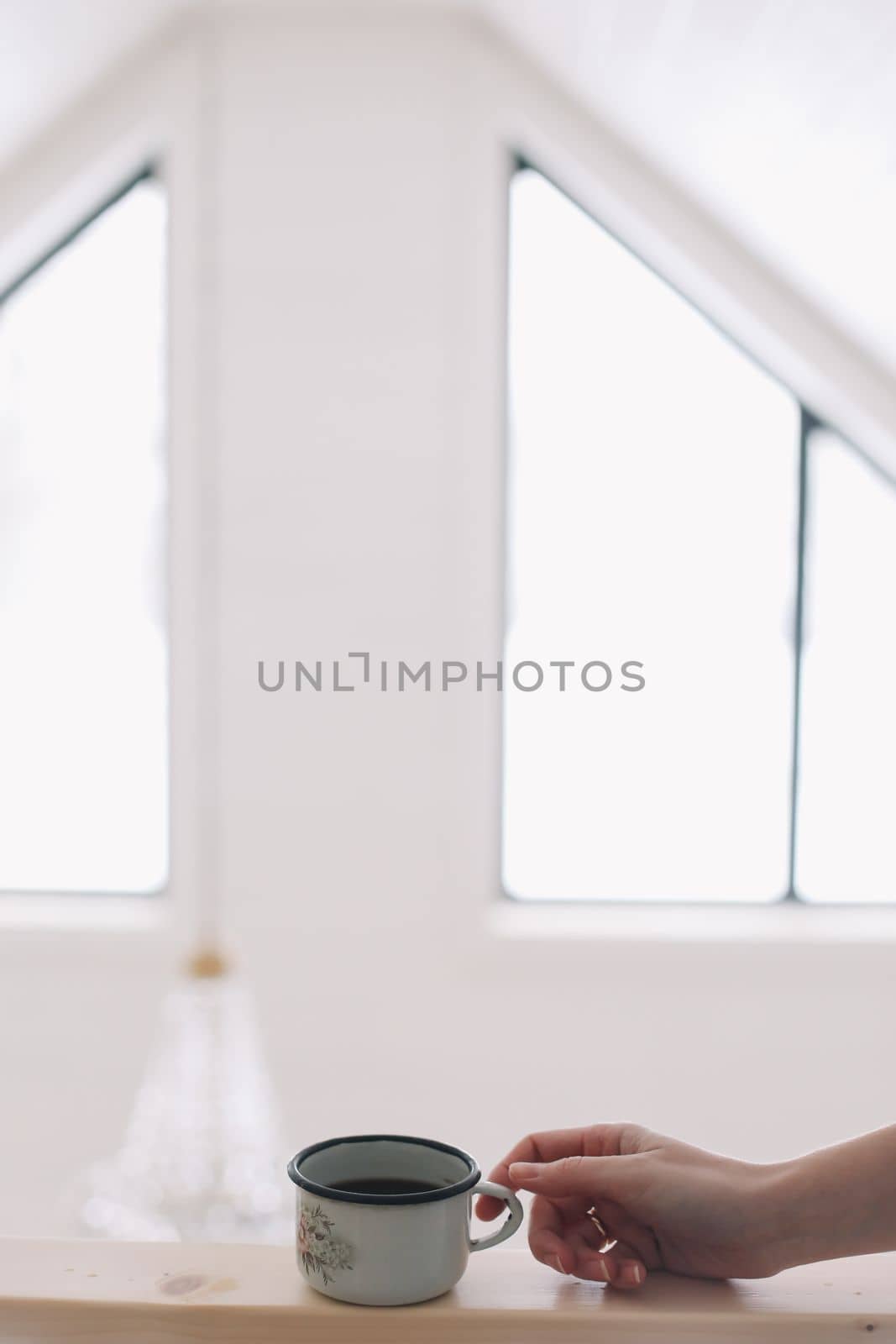 closeup of cup of coffee in luxury white interior.