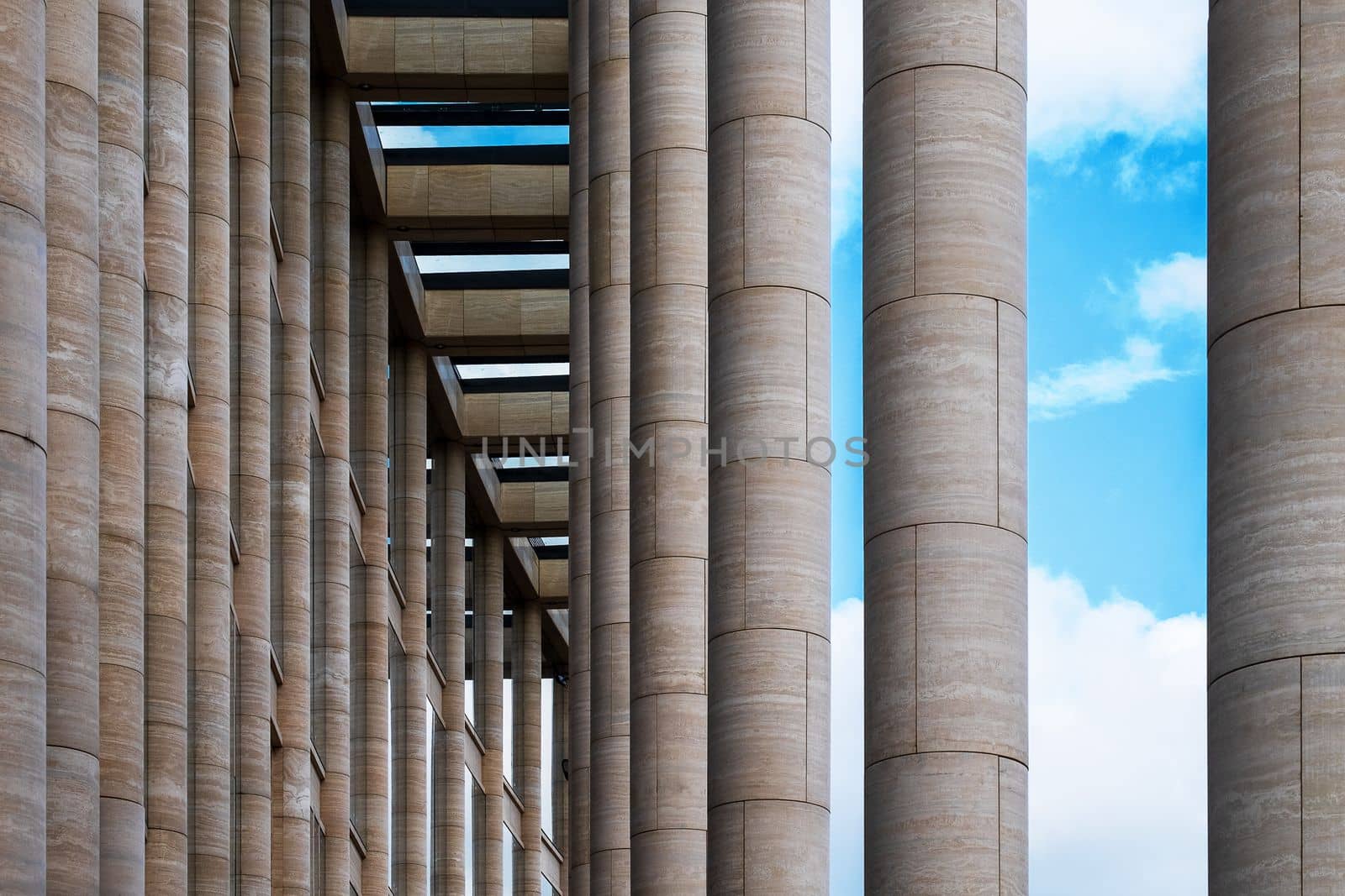 Saint-Petersburg, Russia. - August 22, 2021. Fragment of the facade of a modern building with architectural columns. Selective focus.