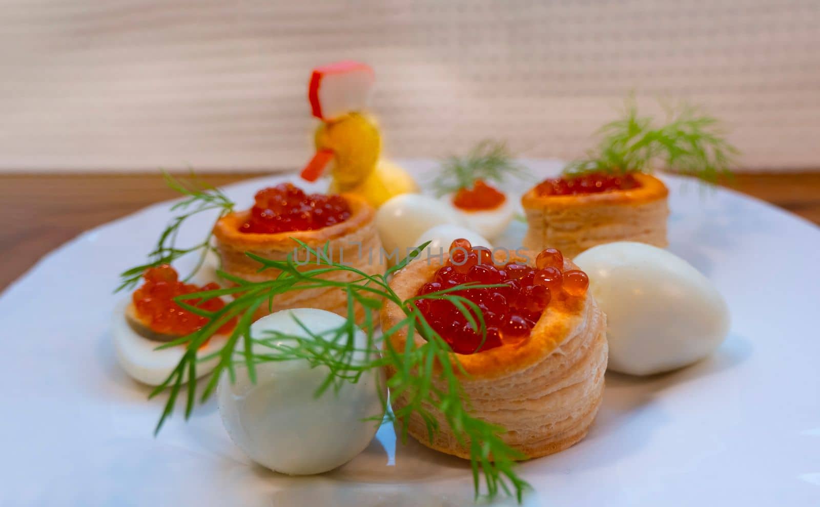 Closeup of caviar and cream cheese appetizer on crackers. High quality photo