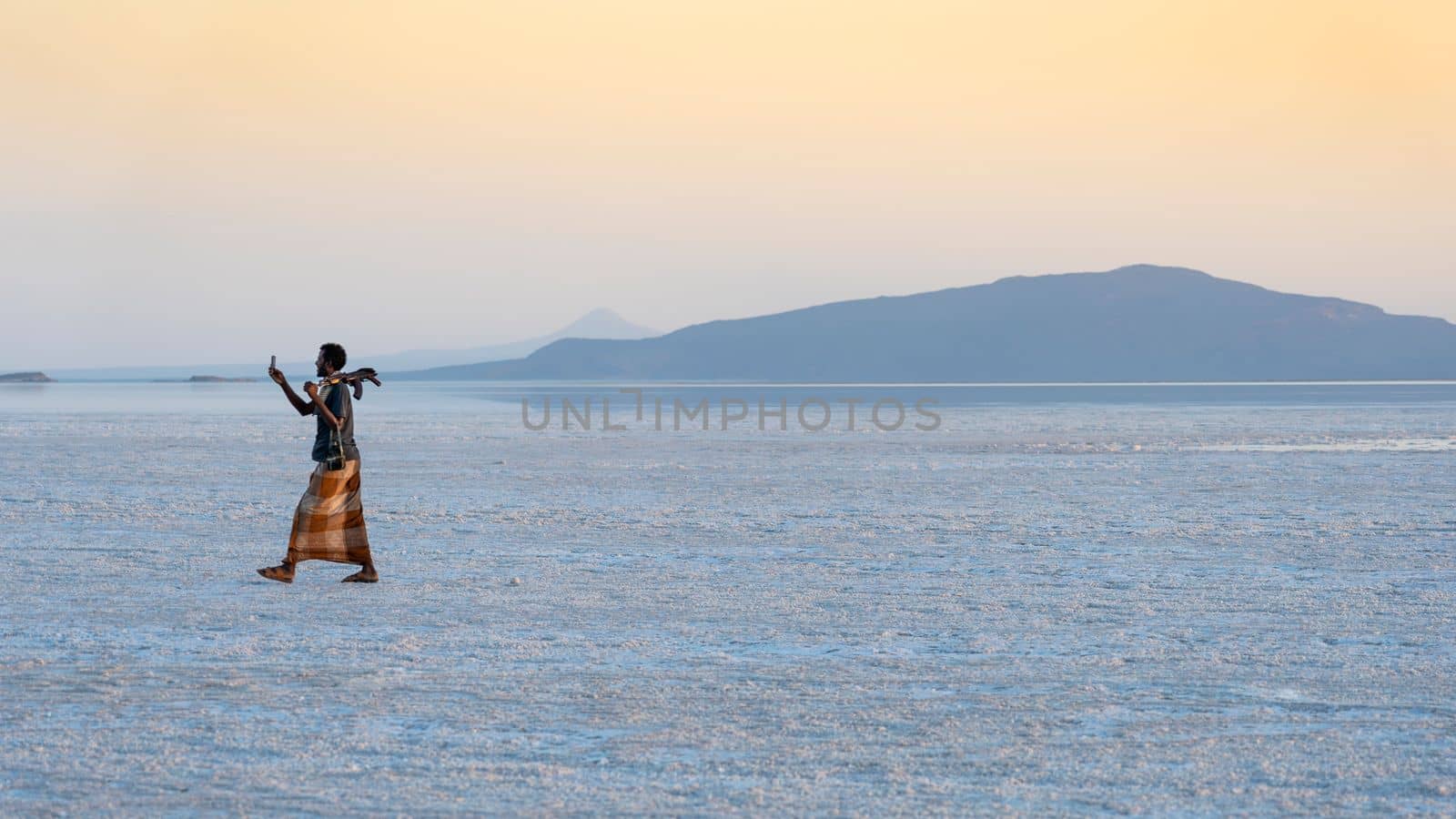 Sunset on the salt plains of Asale Lake in the Danakil Depression in Ethiopia, Africa.