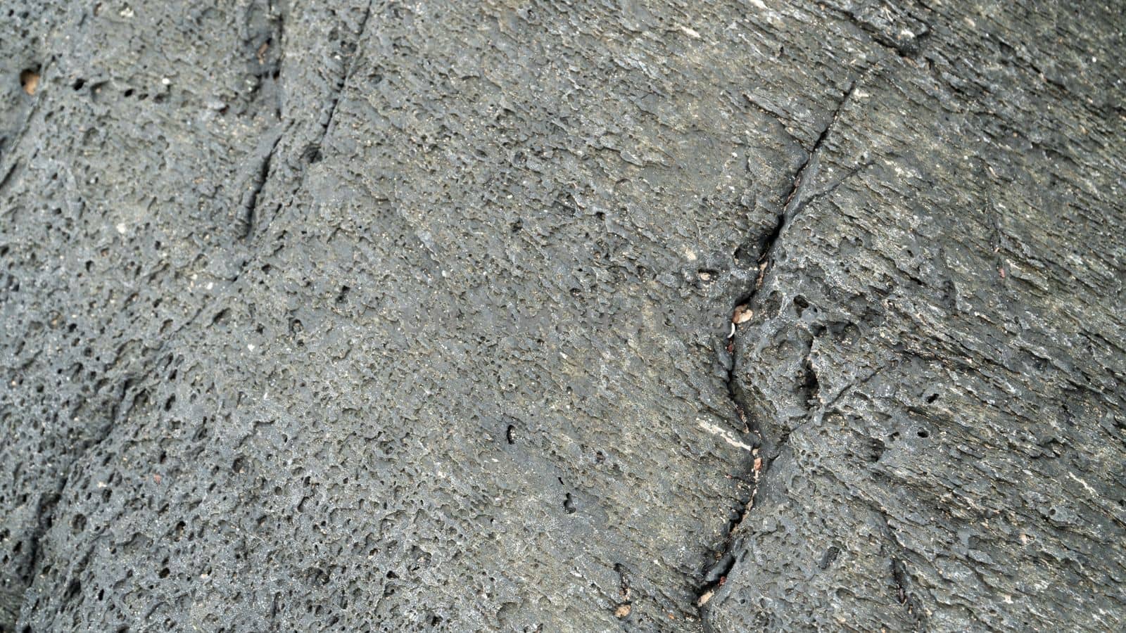 Grey stone with cracks, stone texture. High quality photo