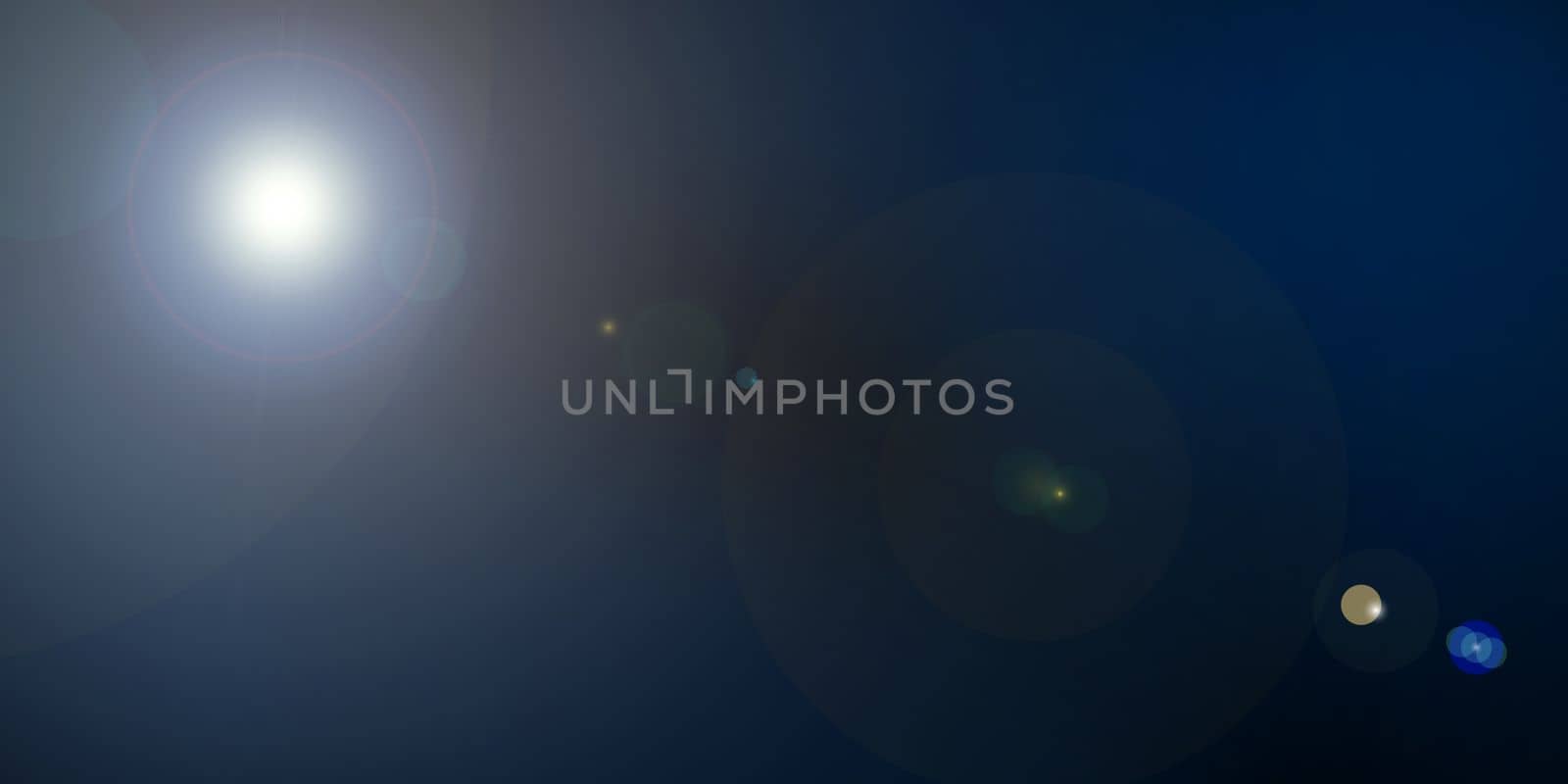 Natural optical lens flare on black background. Sun light leak banner with copy space for text. by PaulCarr