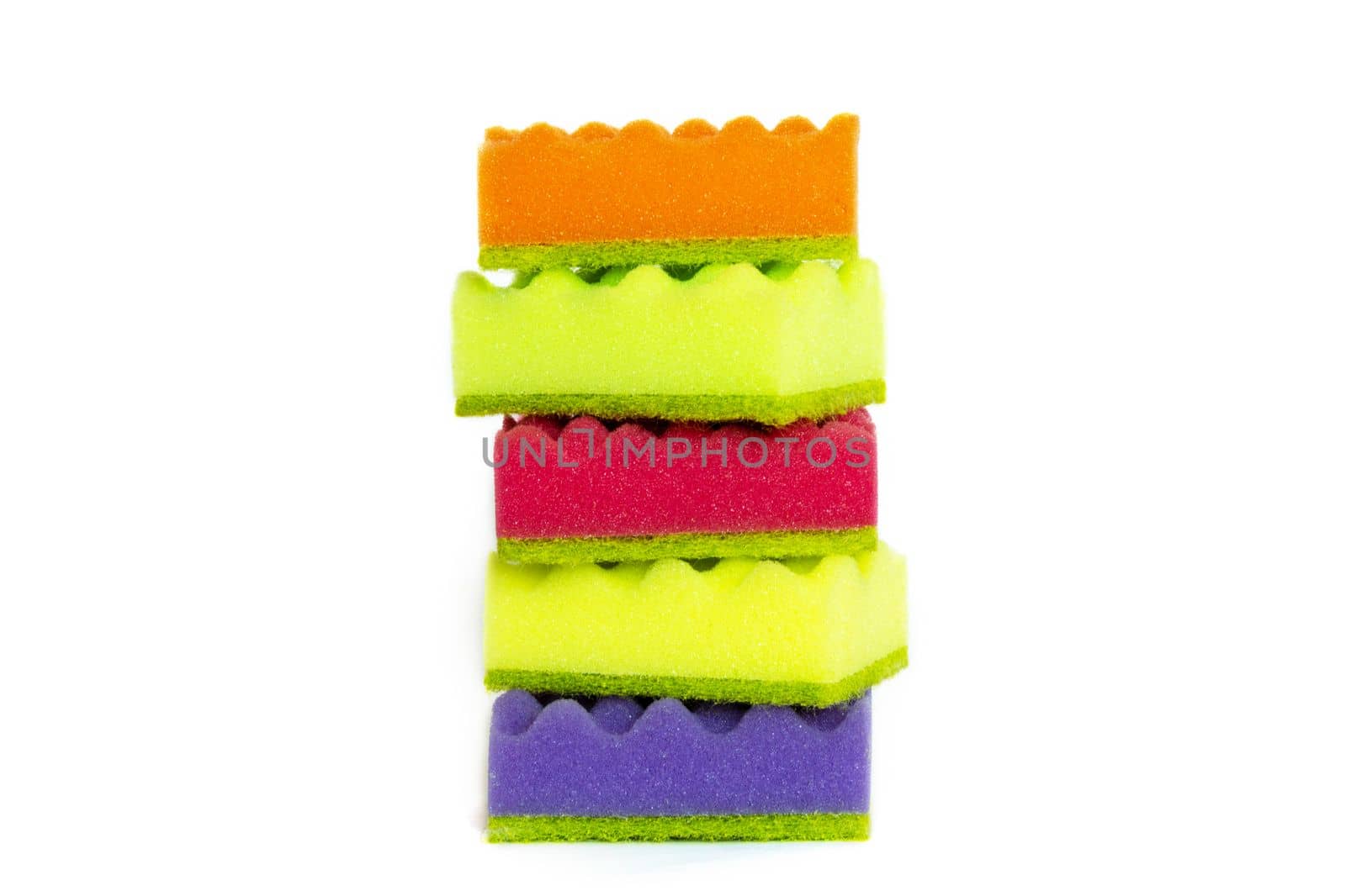 Stack of many multi-colored dish wash sponges isolated on white background. Household cleaning scrub pad.