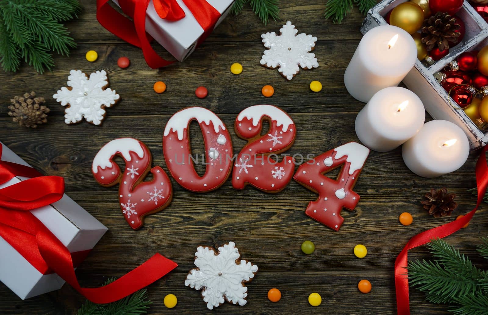 Gingerbread cookies in the form of numbers 2024 are laid out on a wooden table by Spirina