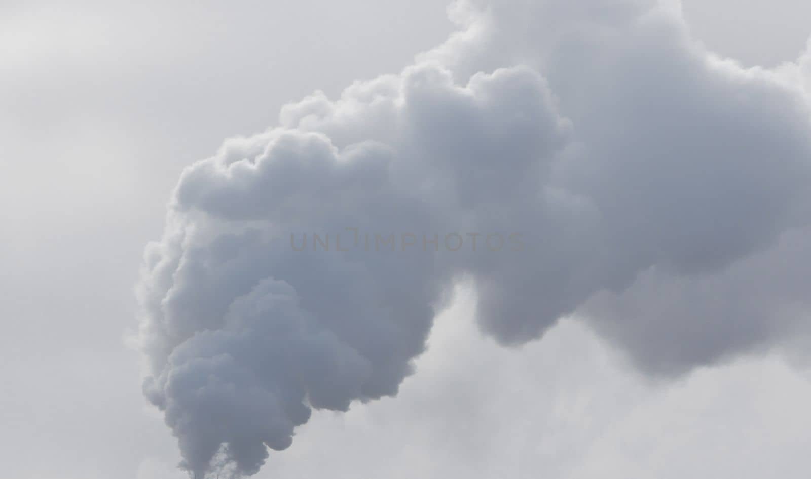 Air pollution with black smoke from chimneys and industrial waste. Heavy air pollution from Chinese factory smokestack