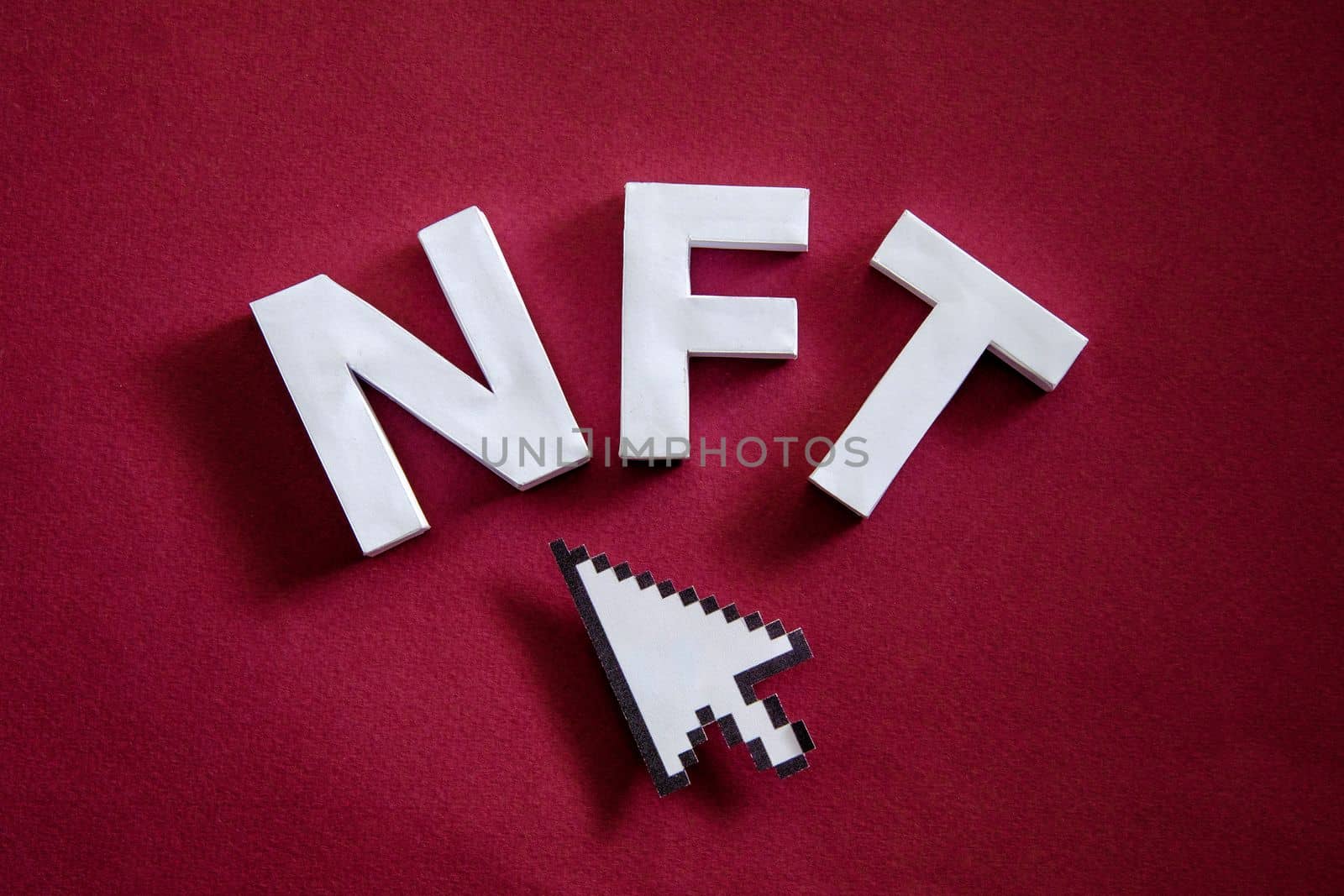 NFT text token symbol of online technologies and innovations for buying and selling digital property and mouse pointer. High quality photo