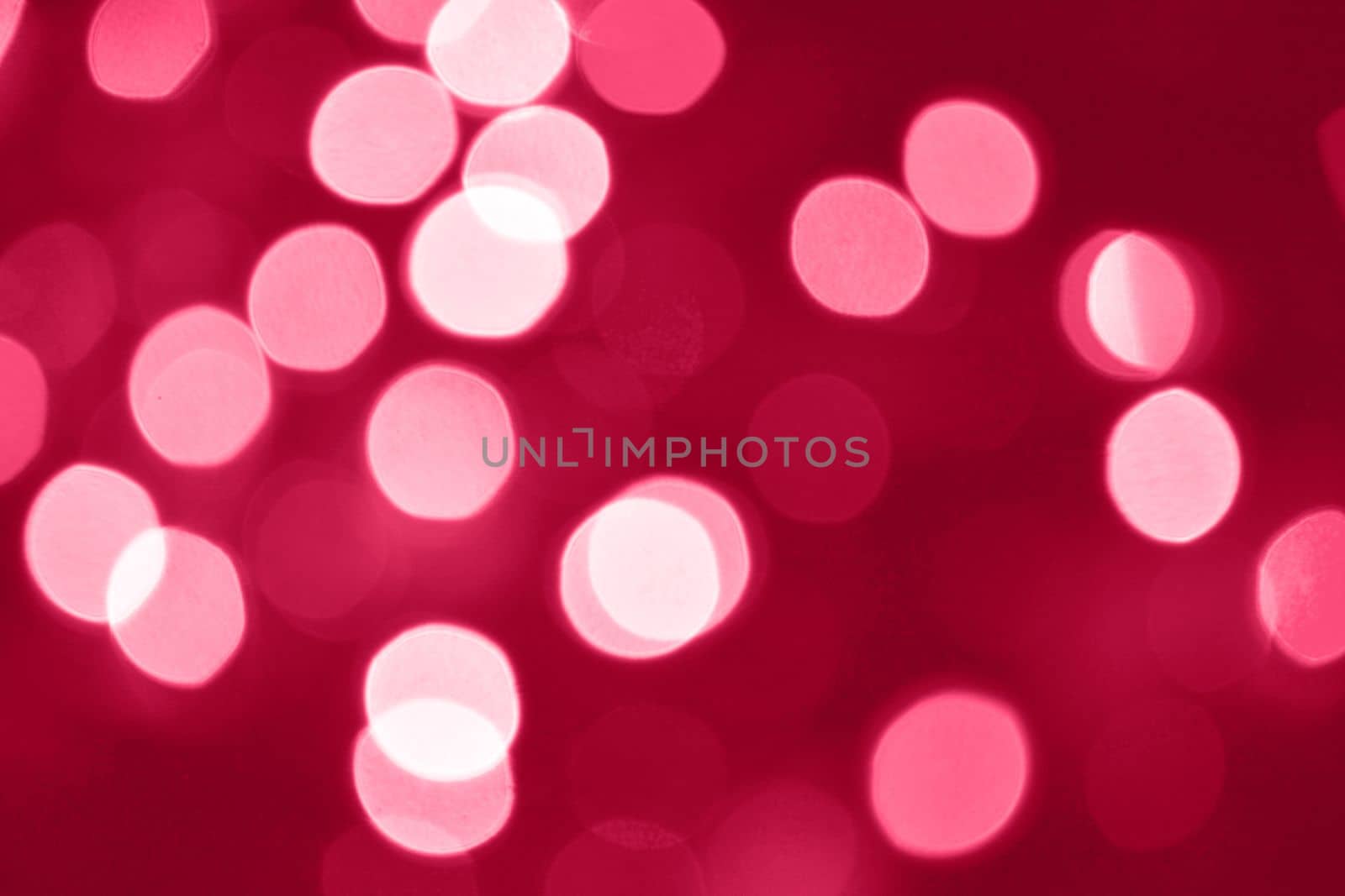 Viva Magenta lights bokeh background, Chrismas lights bokeh. Viva Magenta abstract background. Blurred and glowing lights. Viva Magenta bokeh lens effect from lighting spots. High quality photo