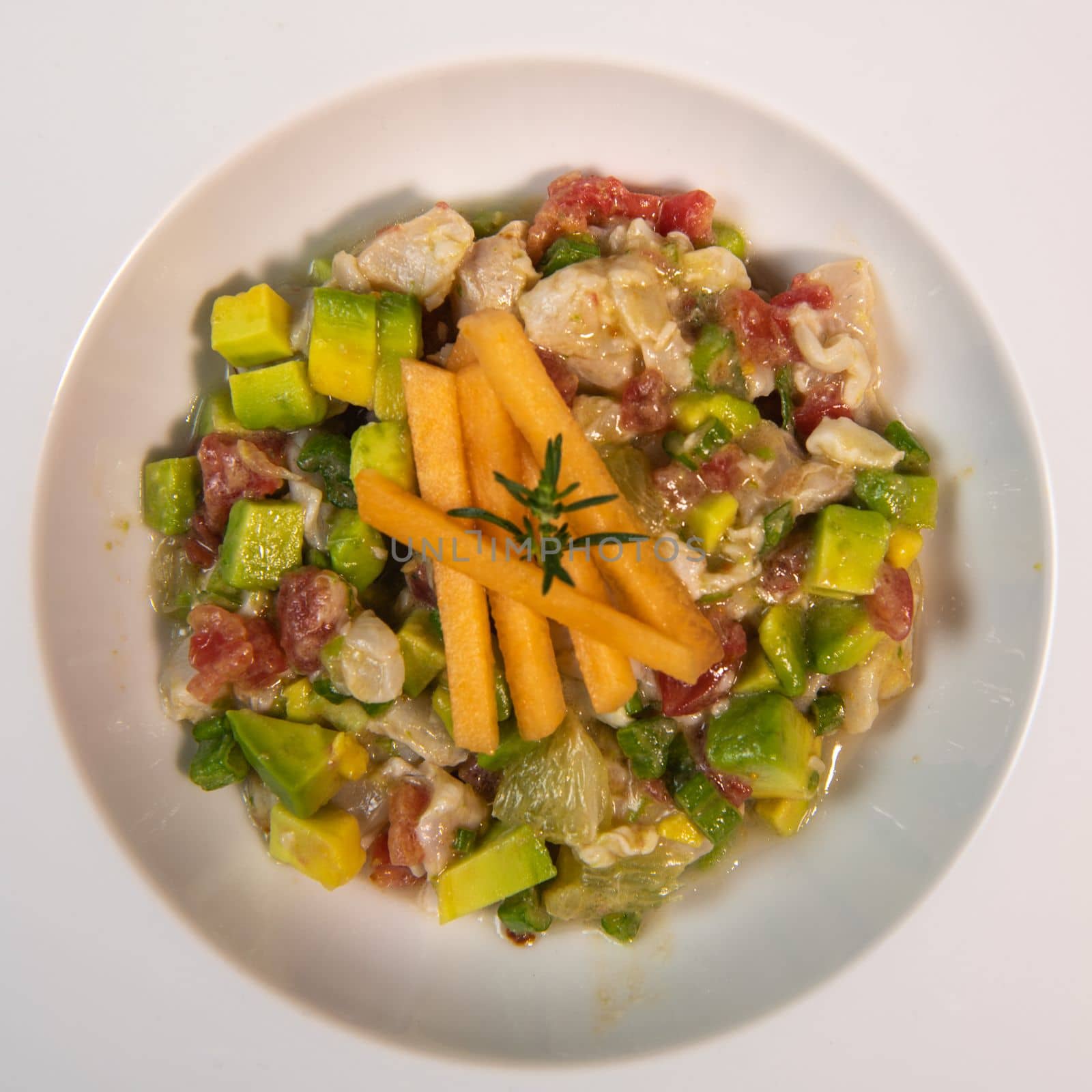 Recipe for ceviche of sea bream with avocado, chilli and lime. High quality photo