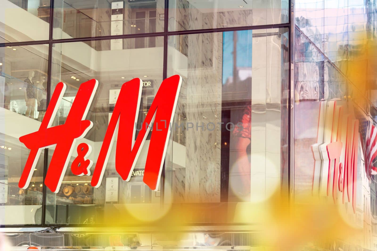 NEW YORK - CIRCA MARCH 2016: close up shot of H and M logo. H and M Hennes and Mauritz AB is a Swedish multinational retail-clothing company, known for its fast-fashion clothing by Mariakray