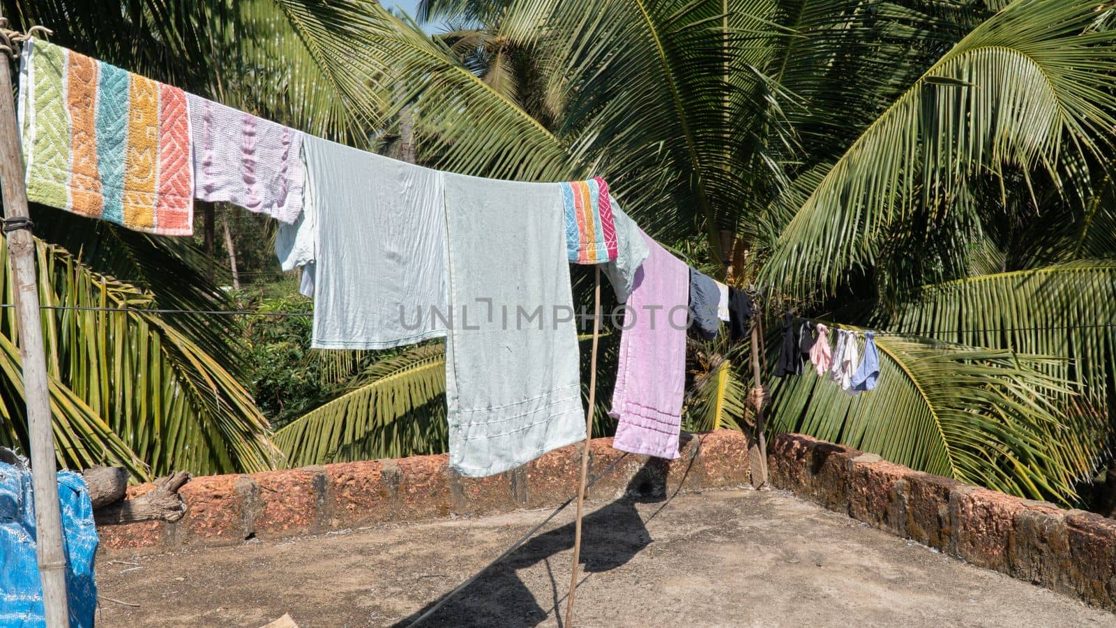 Laundry to dry on the roof under the sun on a rope, lack of technology by voktybre